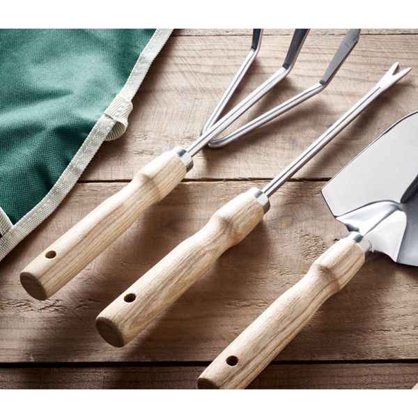 Garden tools in apron Greenhands